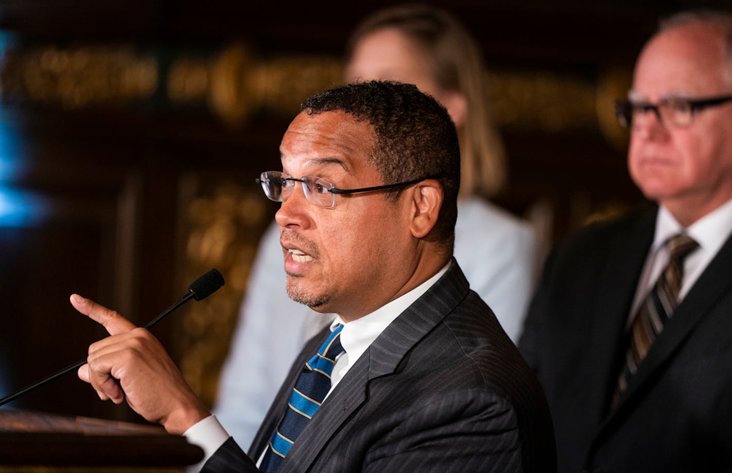 Gov. Tim Walz, right, gave Attorney General Keith Ellison authority to look into price gouging on items needed for the health and welfare of Minnesotans.