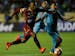 Angelo Rodriguez, left, of Colombia's Tolima, fights for the ball with Jorge Flores of Bolivia's Bolivar during a Copa Sudamericana soccer match in La