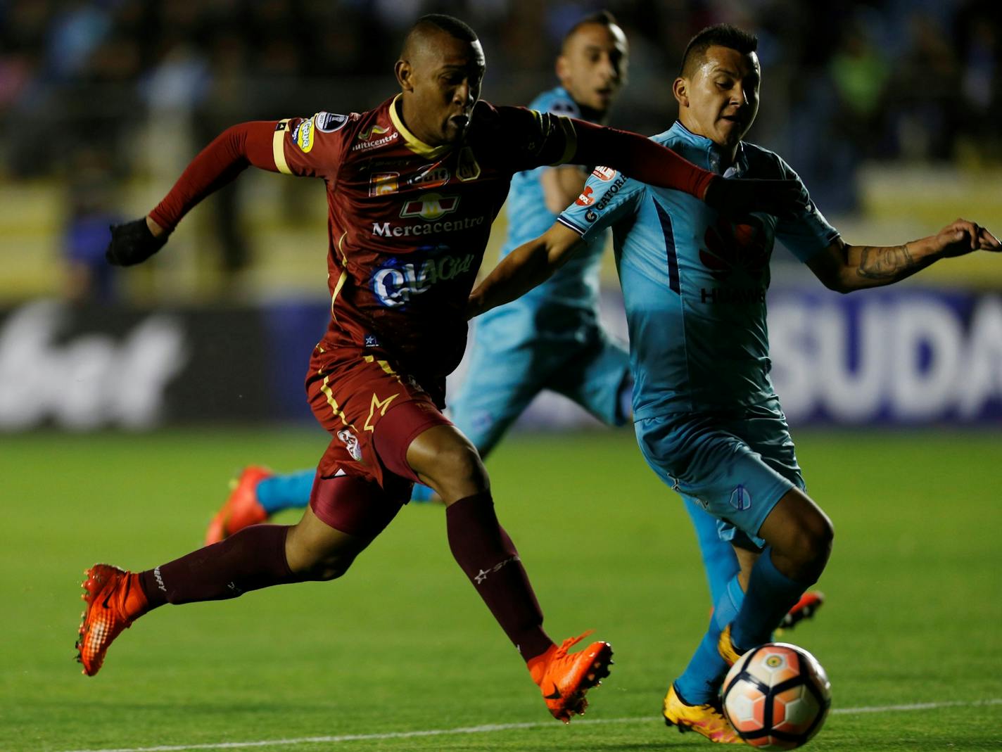 Angelo Rodriguez, left, of Colombia's Tolima, fights for the ball with Jorge Flores of Bolivia's Bolivar during a Copa Sudamericana soccer match in La Paz, Bolivia, Thursday, June 1, 2017. (AP Photo/Juan Karita) ORG XMIT: XJK108