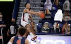Gonzaga guard Jalen Suggs keeps the ball from going out of bounds during the second half of the team's NCAA college basketball game against Pepperdine