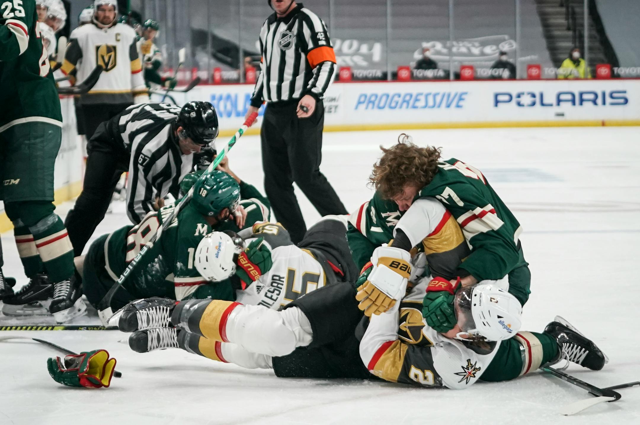 Wild rookie Kirill Kaprizov (97) and Vegas Golden Knights defenseman Zach Whitecloud (2) fought on the ice in the first period Wednesday night.