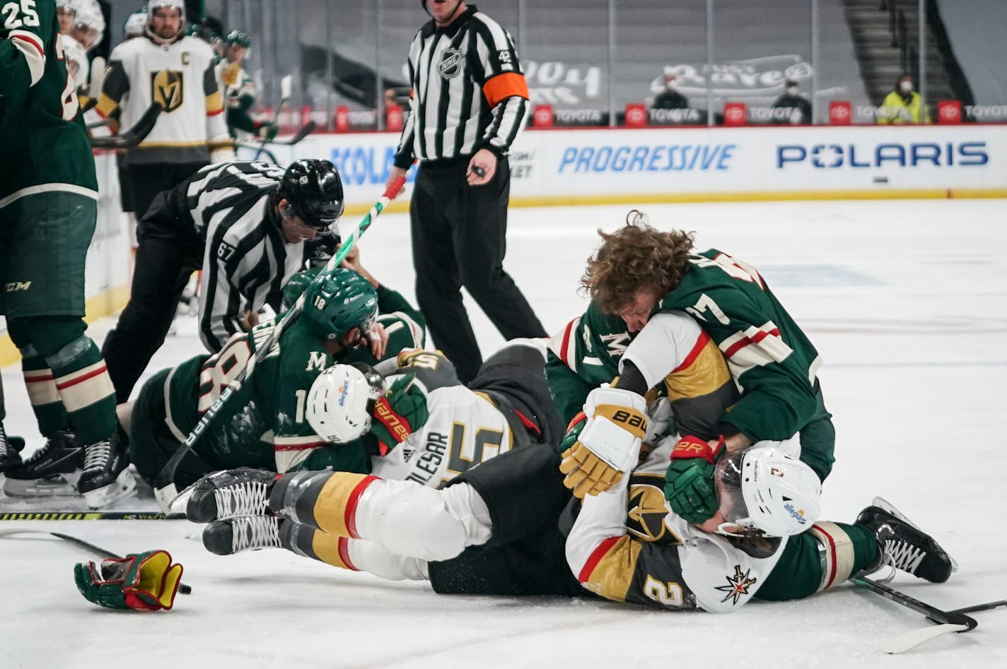 Wild rookie Kirill Kaprizov (97) and Vegas Golden Knights defenseman Zach Whitecloud (2) fought on the ice in the first period Wednesday night.