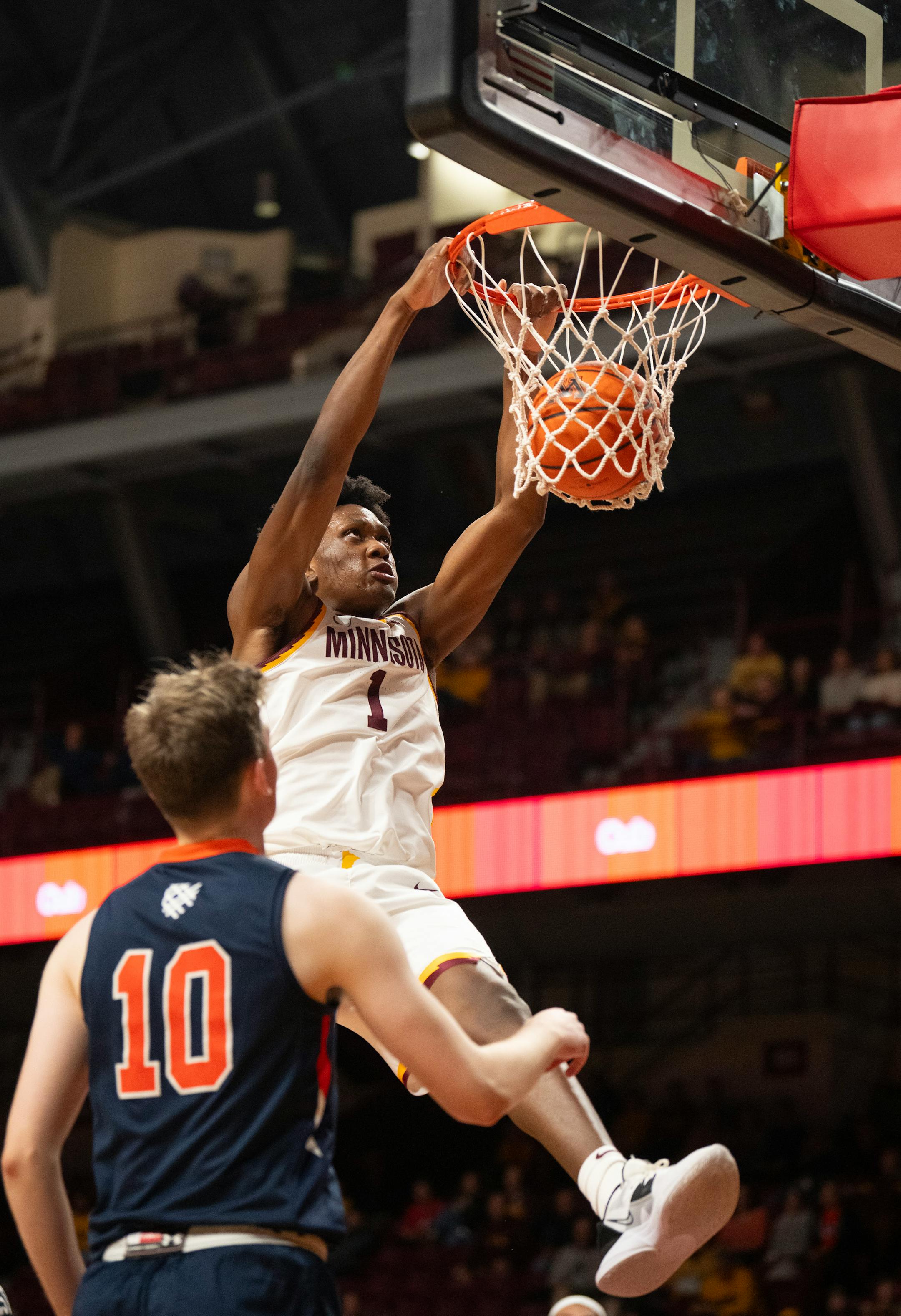 Minnesota Gophers forward Joshua Ola-Joseph (1) with one of his dunks in the first half.