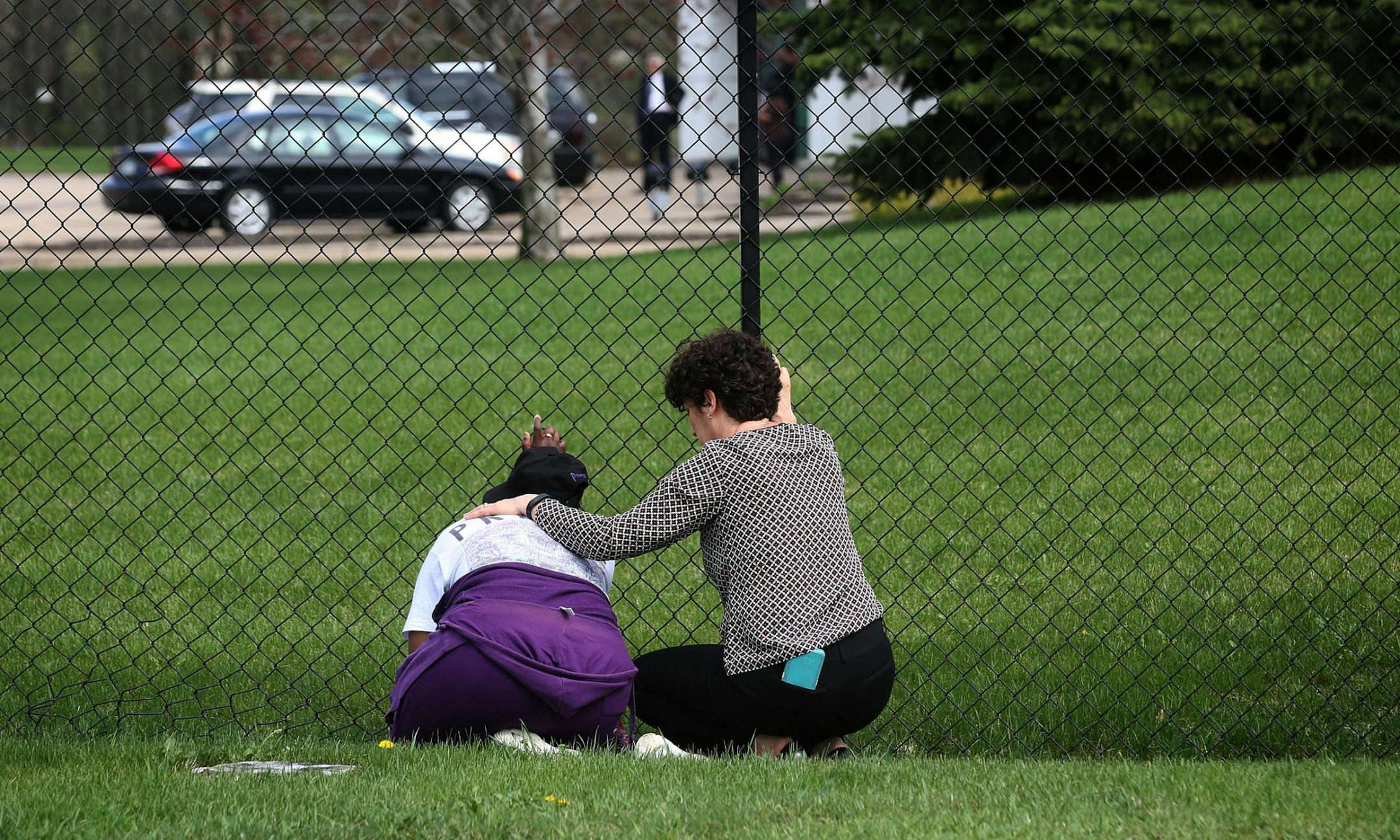 A woman was comforted by another mourner.