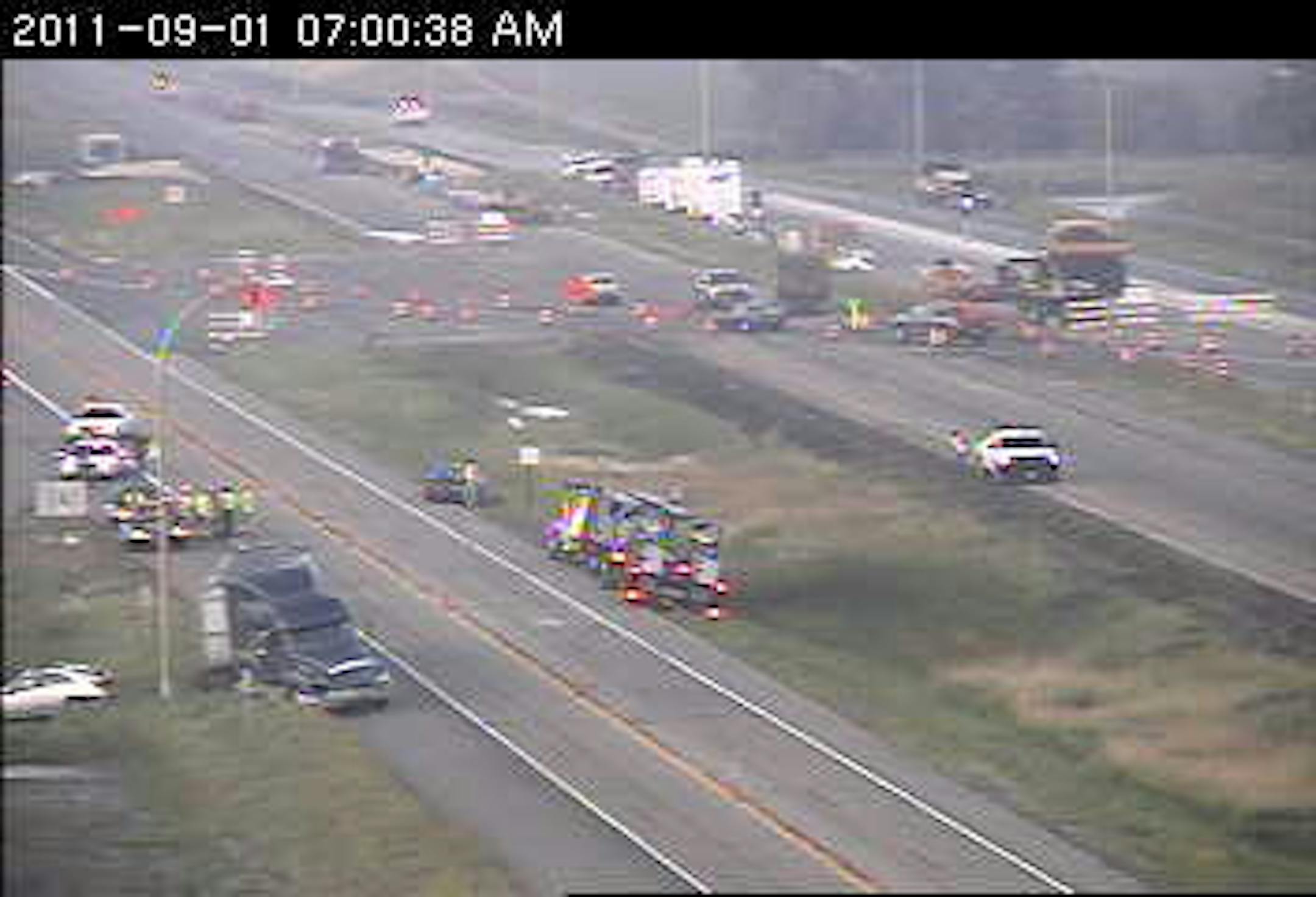 A crash on I-35E in Lino Lakes has killed one person. A semitrailer truck and a car in the lower right of this photo from a MnDOT camera apparently were involved in the accident.