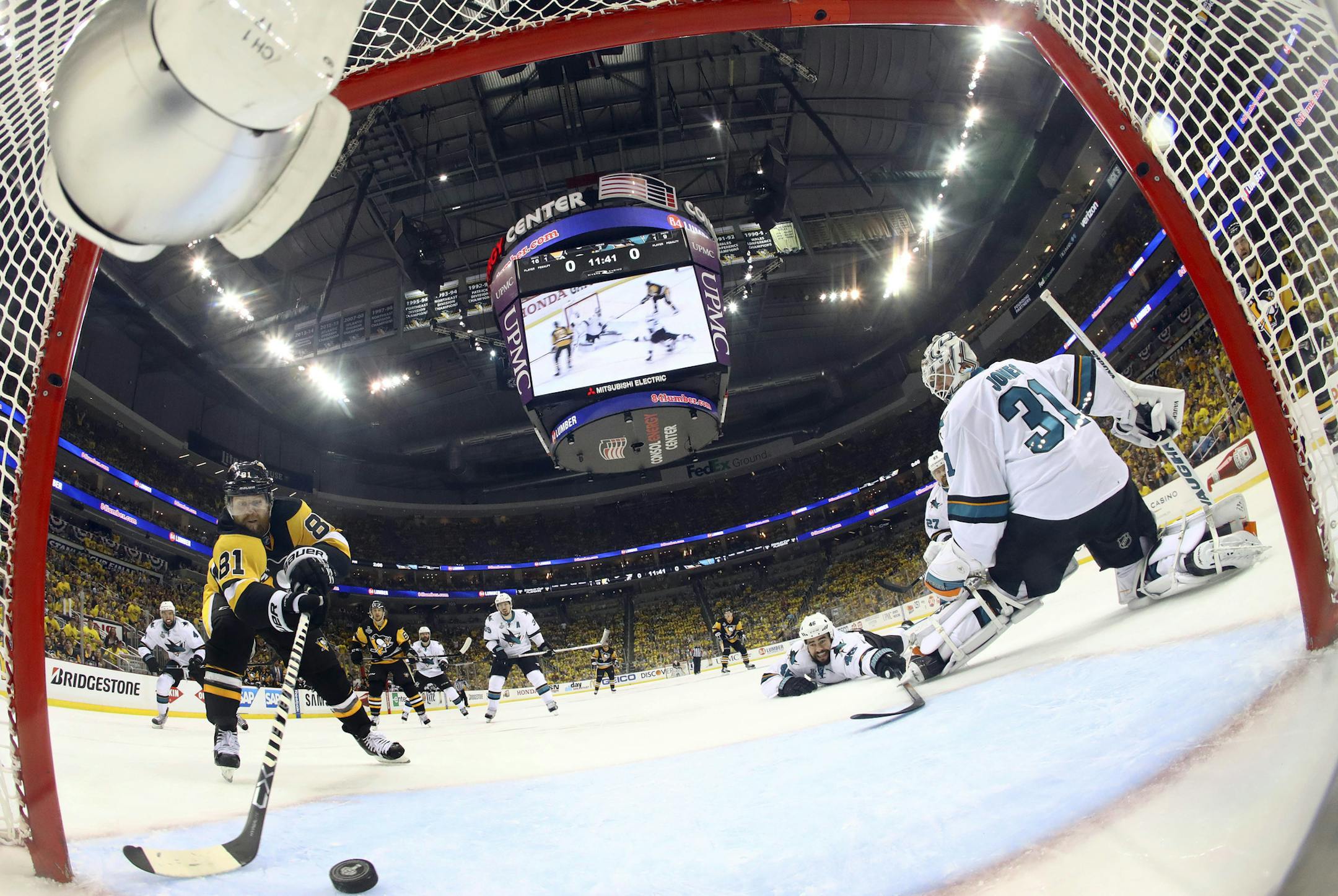 Pittsburgh Penguins' Phil Kessel (81) scores a goal behind San Jose Sharks goalie Martin Jones (31) during the second period in Game 2 of the NHL hockey Stanley Cup Finals on Wednesday, June 1, 2016, in Pittsburgh. (Bruce Bennett/Pool Photo via AP)