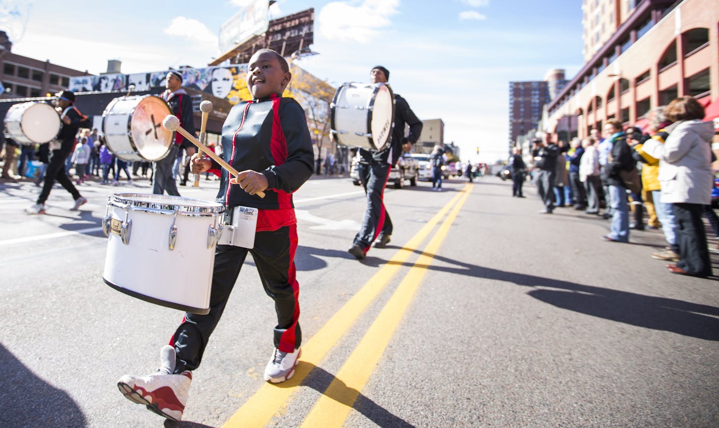 Members of the Unlimited Next Level Drill and Dance Team march in the parade. ] (LEILA NAVIDI/STAR TRIBUNE) leila.navidi@startribune.com BACKGROUND INFORMATION: A parade and rally for the Minnesota Lynx to celebrate their 2015 WNBA Championship in downtown Minneapolis on October 16, 2015.