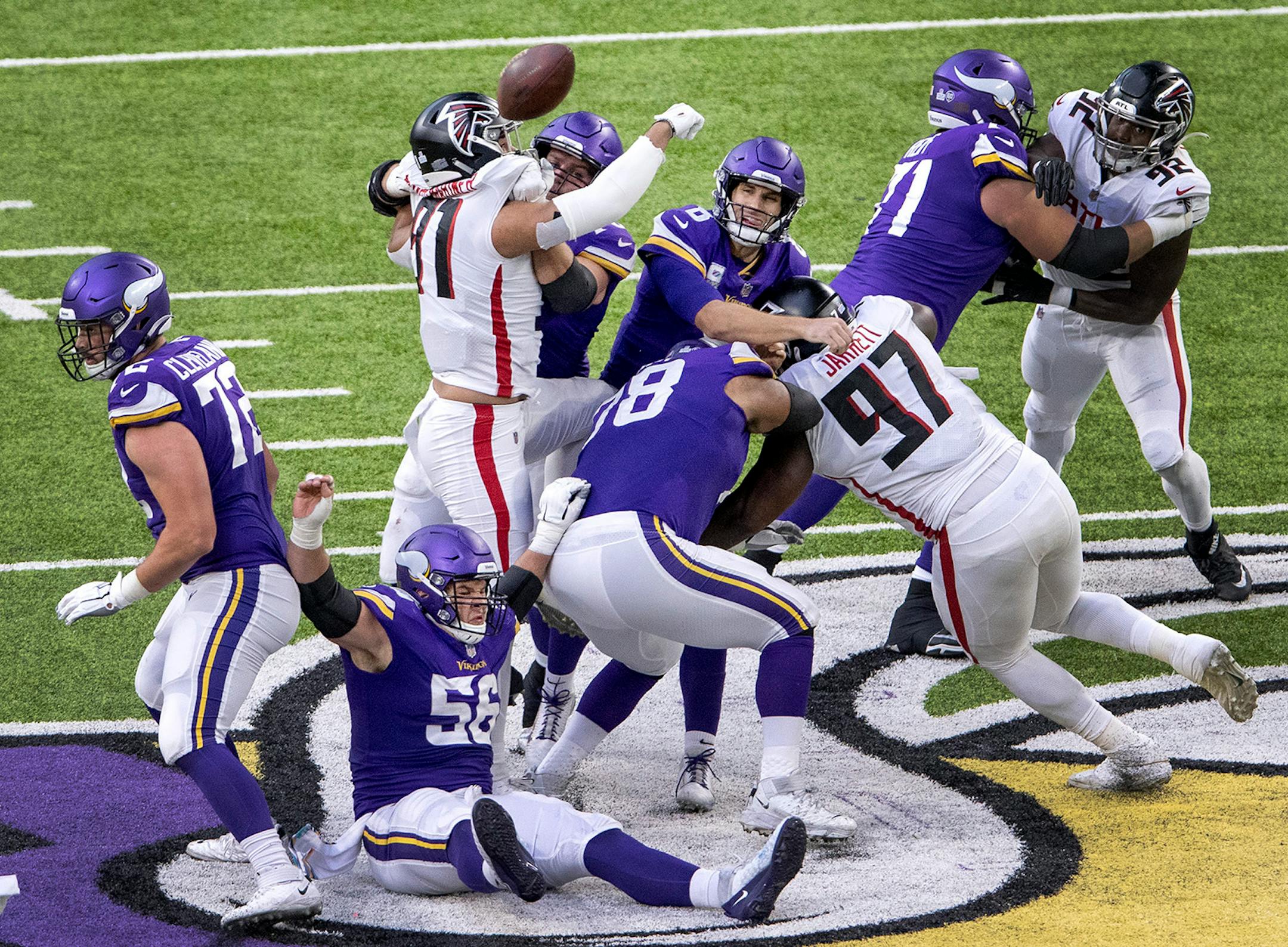 Jacob Tuioti-Mariner (91) of the Atlanta Falcons deflected a pass by Minnesota Vikings quarterback Kirk Cousins (8) that was intercepted in the second quarter.