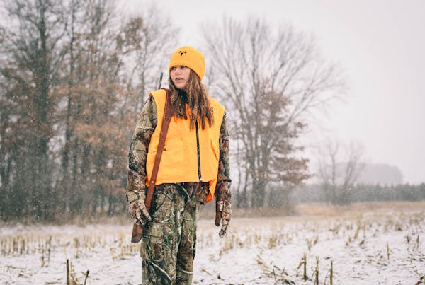 A teenage hunter scanned a harvested cornfield for any sign of movement.