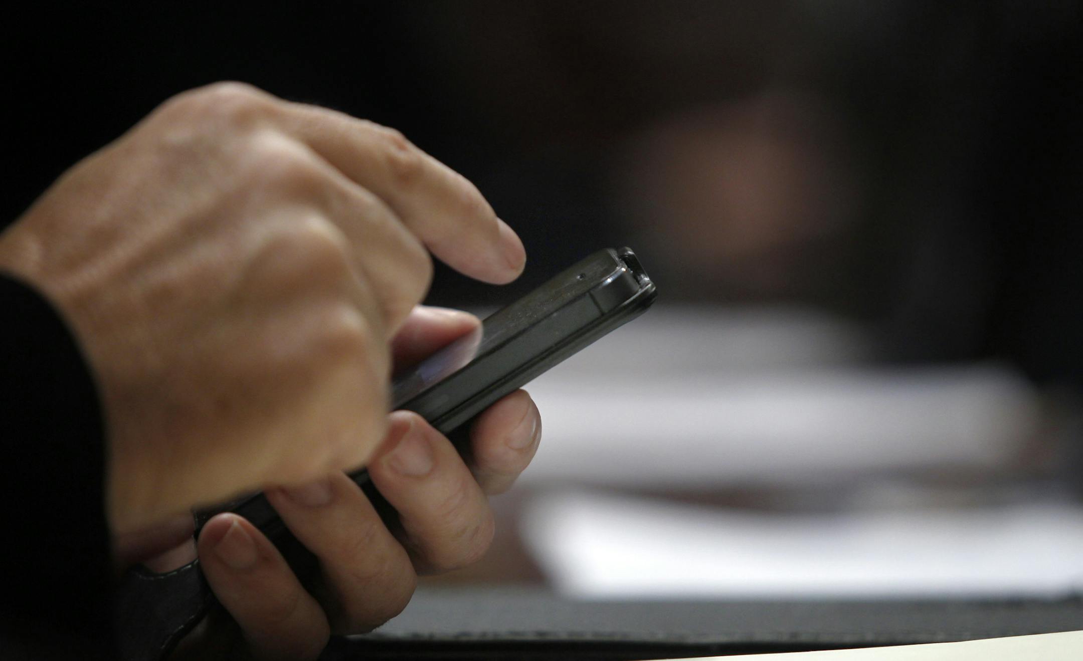 A Spanish lawmaker uses his cell phone at the Spain's parliament, in Madrid, Wednesday, Oct. 30, 2013. Speaking in parliament, Spain's Prime Minister Mariano Rajoy said Spain was taking the surveillance allegations seriously and that the head of Spain's intelligence services will address Parliament over allegations that Spain was a target for surveillance by the U.S. National Security Agency. He reiterated that if confirmed, such activity is ìinappropriate and unacceptable between partners