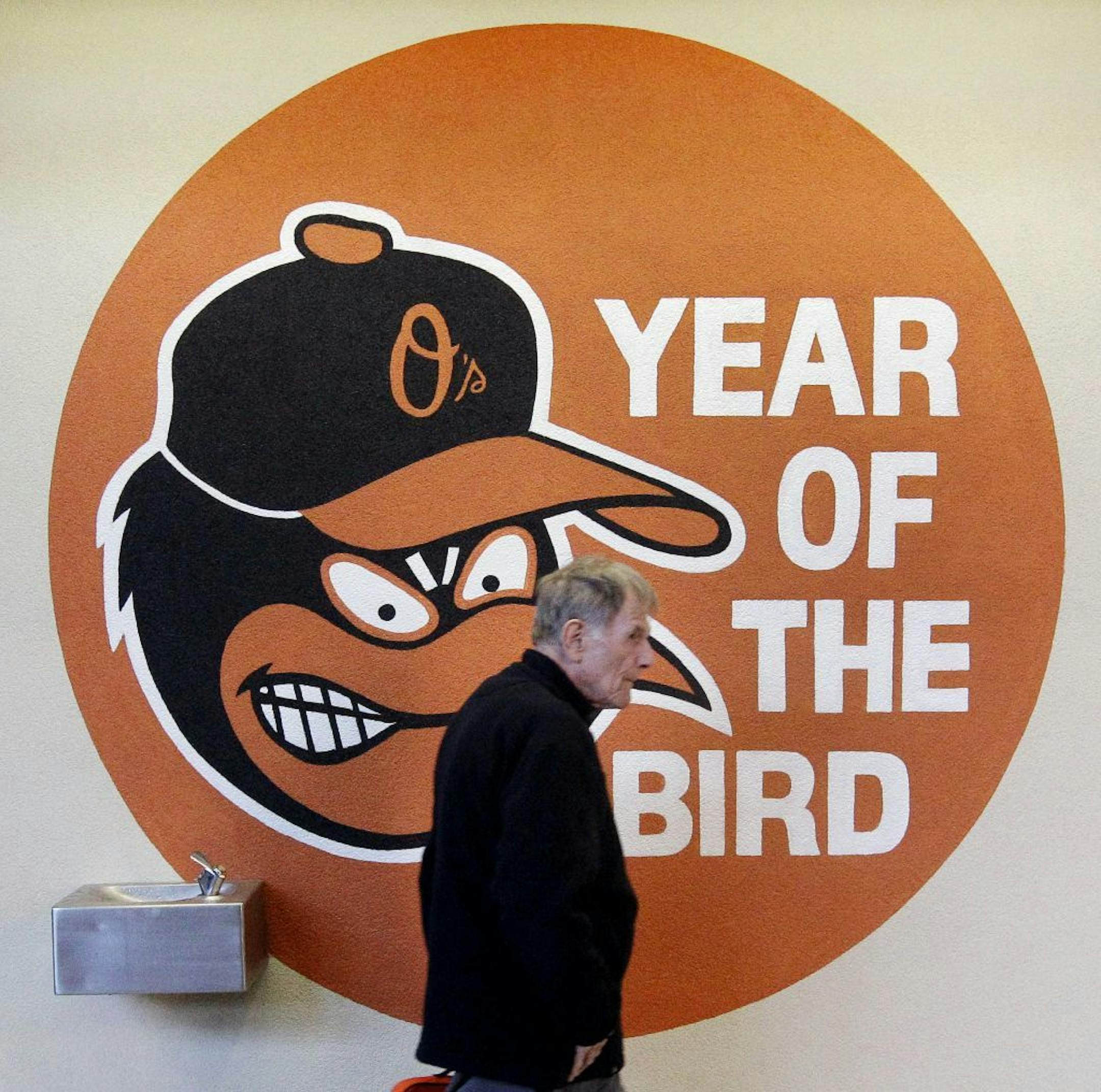 A fan walks on the concourse before a baseball game between the Minnesota Twins and the Baltimore Orioles in Baltimore, Saturday, April 7, 2012.