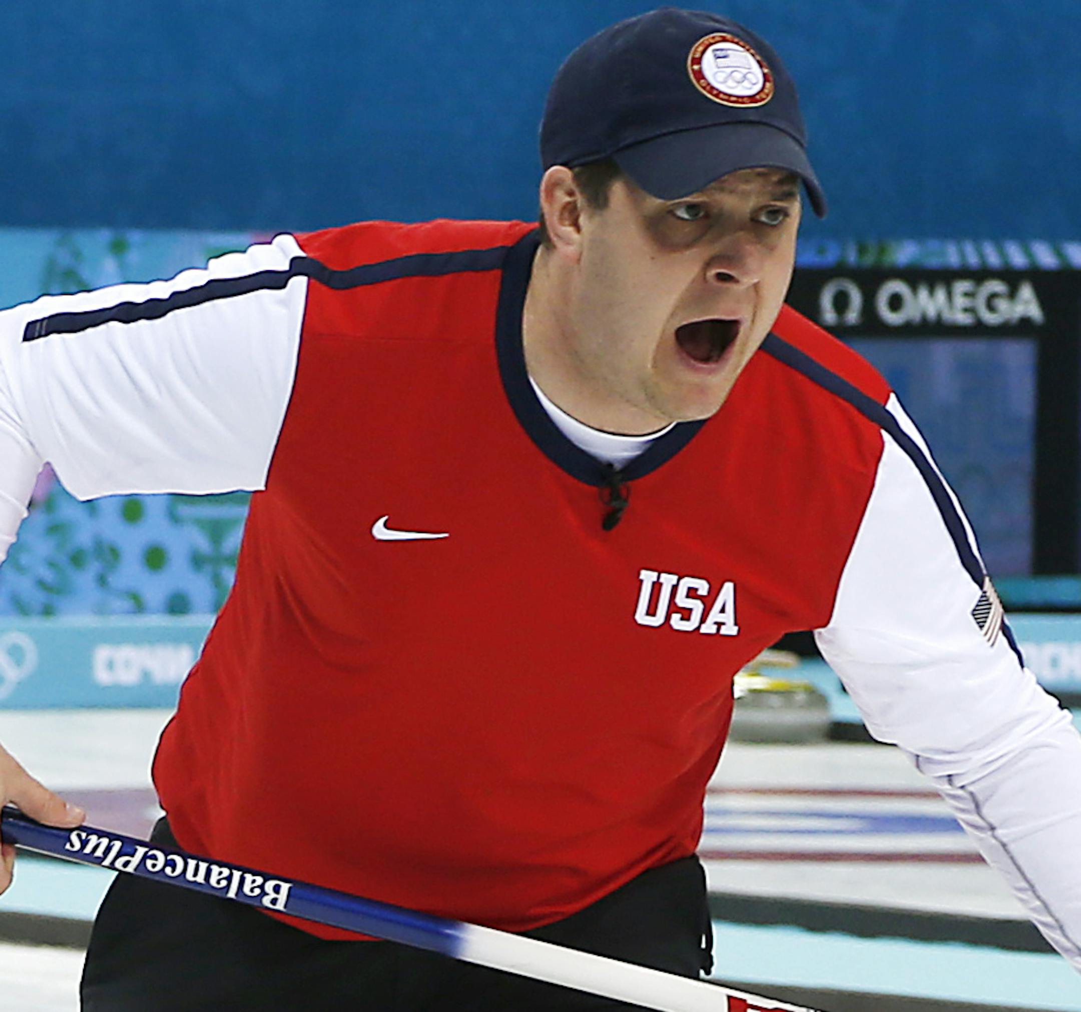 John Shuster of the United States shouts to his teammates during the men's curling match against Canada at the 2014 Winter Olympics, Sunday, Feb. 16, 2014, in Sochi, Russia. (AP Photo/Wong Maye-E)