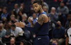 Minnesota Timberwolves' D'Angelo Russell (0) talks to teammates before a play during the first half of an NBA basketball game against the Orlando Magi