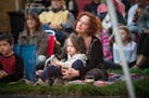 Rachael Moreno and her 5-year-old son, Arlo, watched The Pines perform on Saturday. The eclectic audiences represent all ages and incomes.