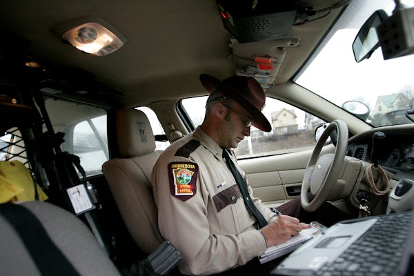 Minnesota State Patrol Sgt. Curt Thurmes wrote a speeding citation along Interstate 94 going eastbound in St. Paul after making a stop in 2009.