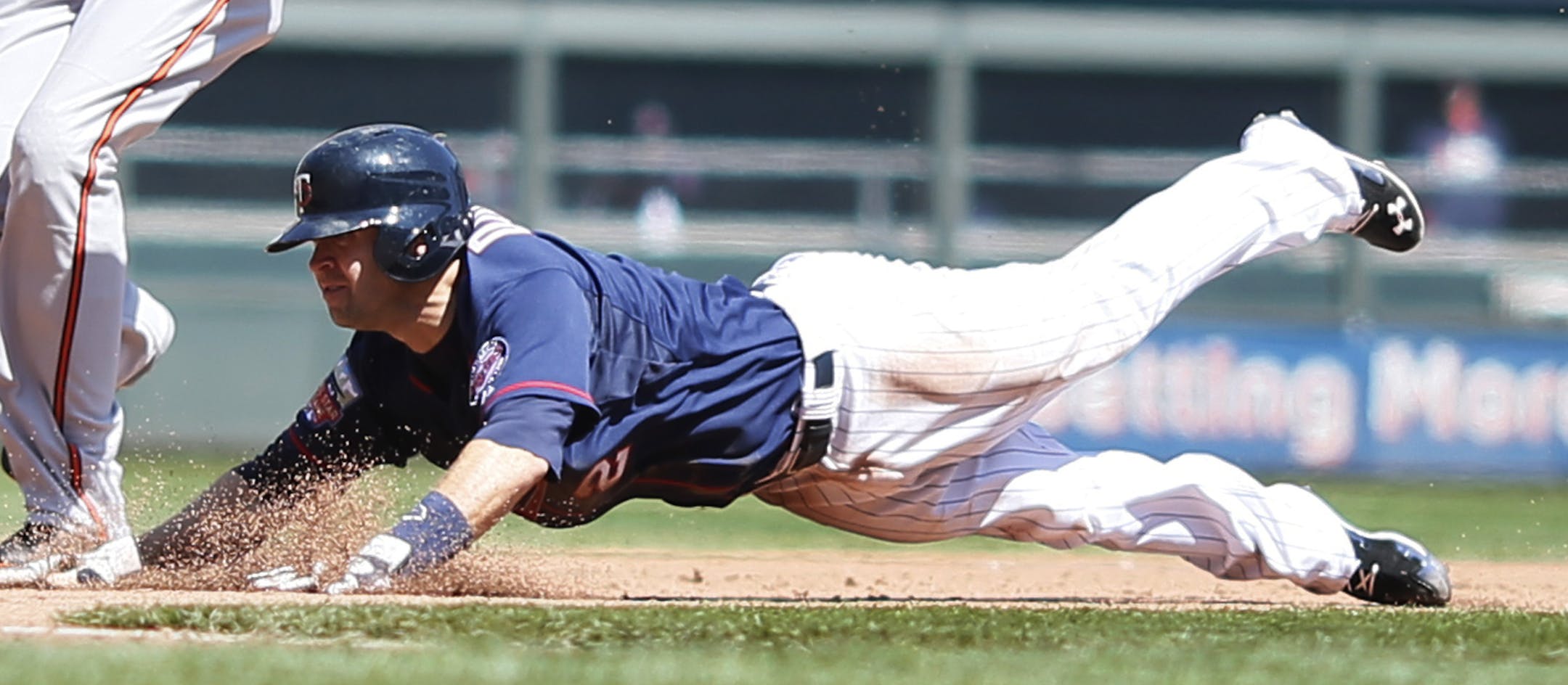 Minnesota Twins second baseman Brian Dozier (2) stole second third base over Baltimore Orioles third baseman Manny Machado (13) in the 5th inning during MLB action between the Minnesota Twins and Baltimore Orioles at Target Field May 4, 2014 in Minneapolis, MN. ] Jerry Holt Jerry.holt@startribune.com