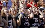 Students at Minnehaha Academy celebrated with a "roller coaster" wave as the homecoming festivities came to an end in the football stands.] Minnehaha 