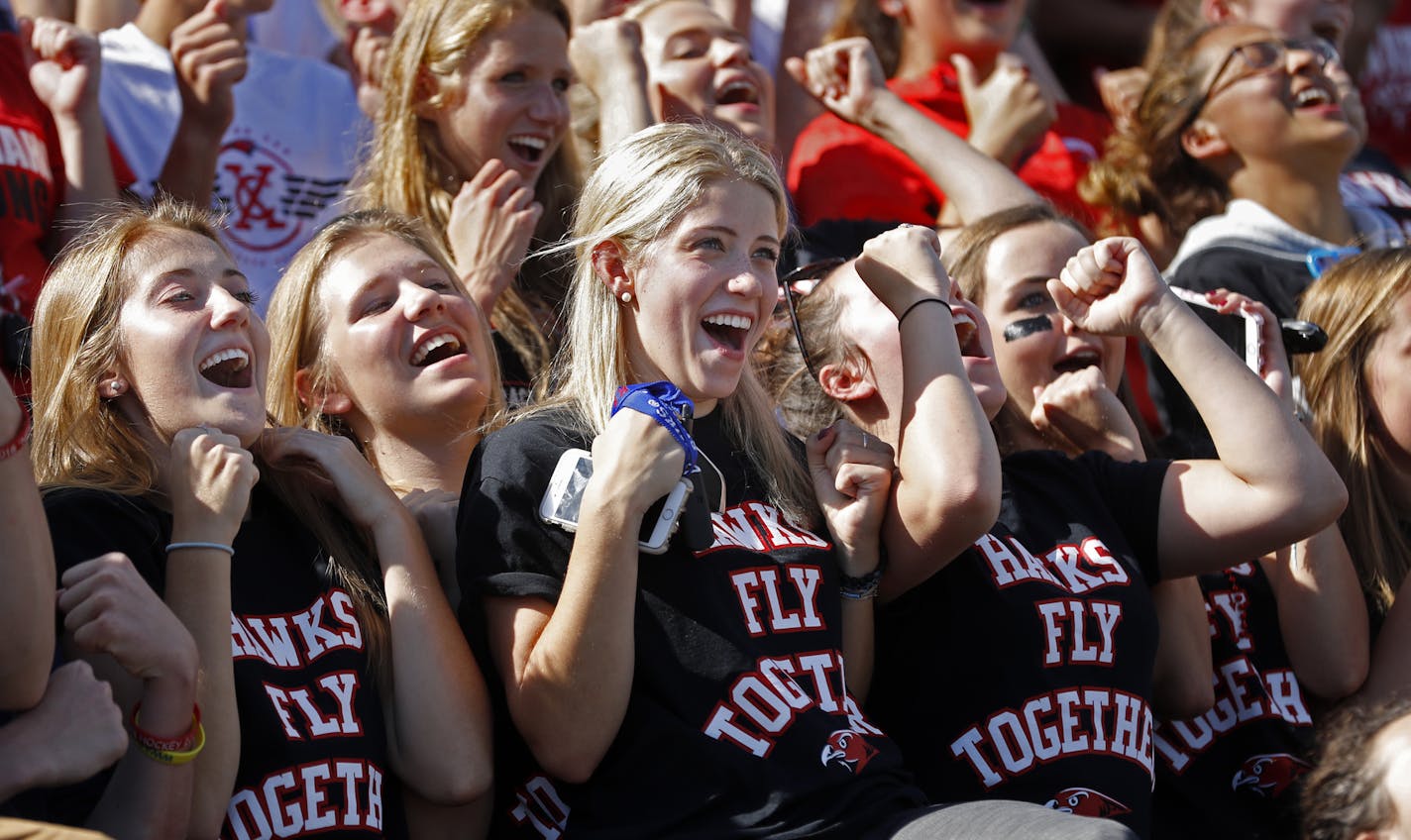 Students at Minnehaha Academy celebrated with a "roller coaster" wave as the homecoming festivities came to an end in the football stands.] Minnehaha Academy celebrates its first "homeless" homecoming weekend w/festival at 4200 W River Pkwy and tennis match at bombed north campus at 32nd and West River Road.Richard Tsong-Taatarii/Richard.tsong-taatarii@startribune.com