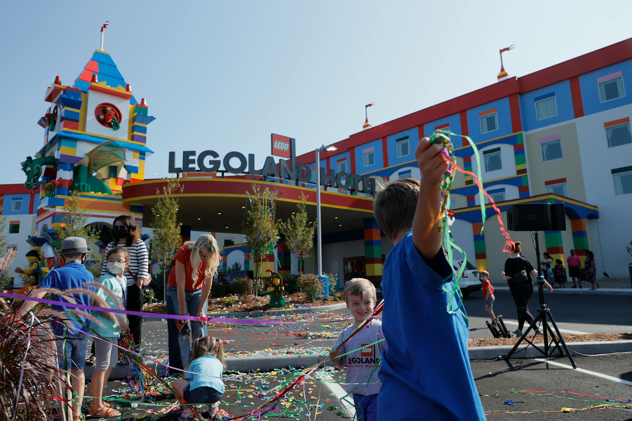 Children play with streamers and confetti from the official grand opening of the LEGOLAND New York Hotel at the LEGOLAND Resort on Aug. 6, 2021, in Goshen, New York. () ORG XMIT: 30341003W