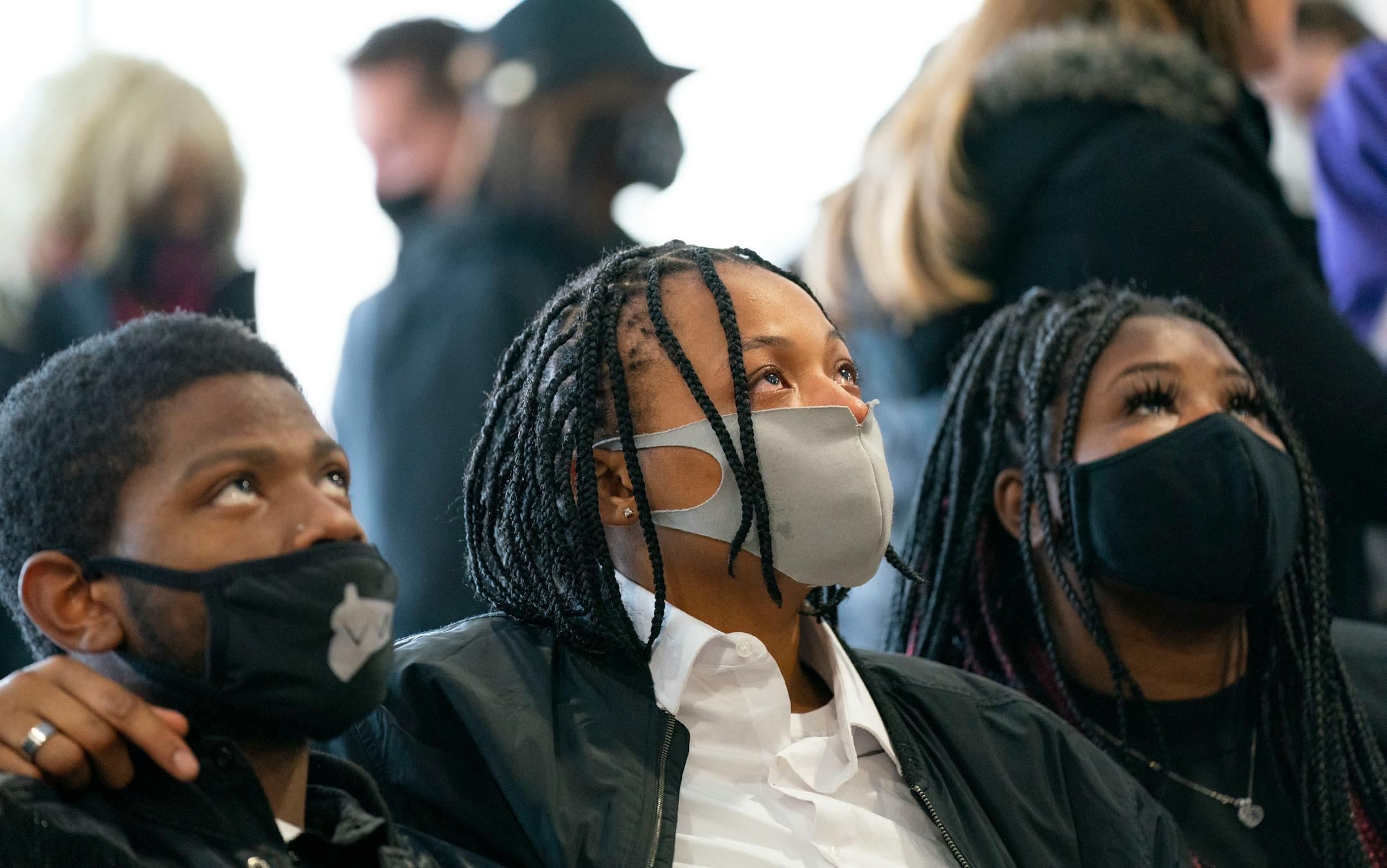 Mourners embrace one another at Jahmari Rice's funeral Wednesday, Feb. 9, 2022 at Hope Presbyterian Church in Richfield.
