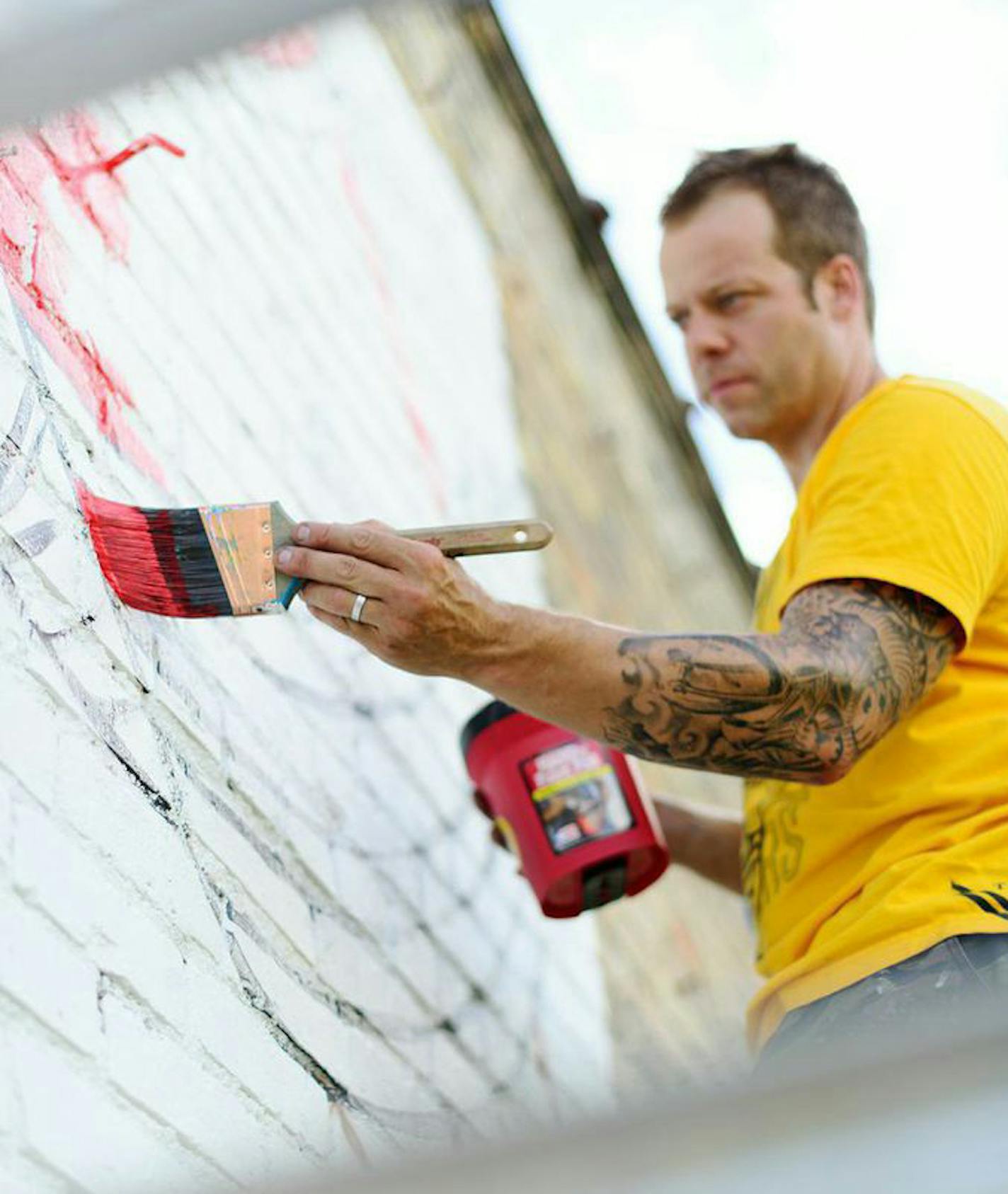 Adam Turman worked on the mural at Sisyphus Brewery, which is one of his many local creations.