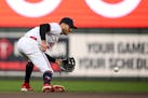 Twins shortstop Carlos Correa fielded a grounder during Monday’s fifth inning vs. the Giants at Target Field. Correa was scratched from Tuesday’s 