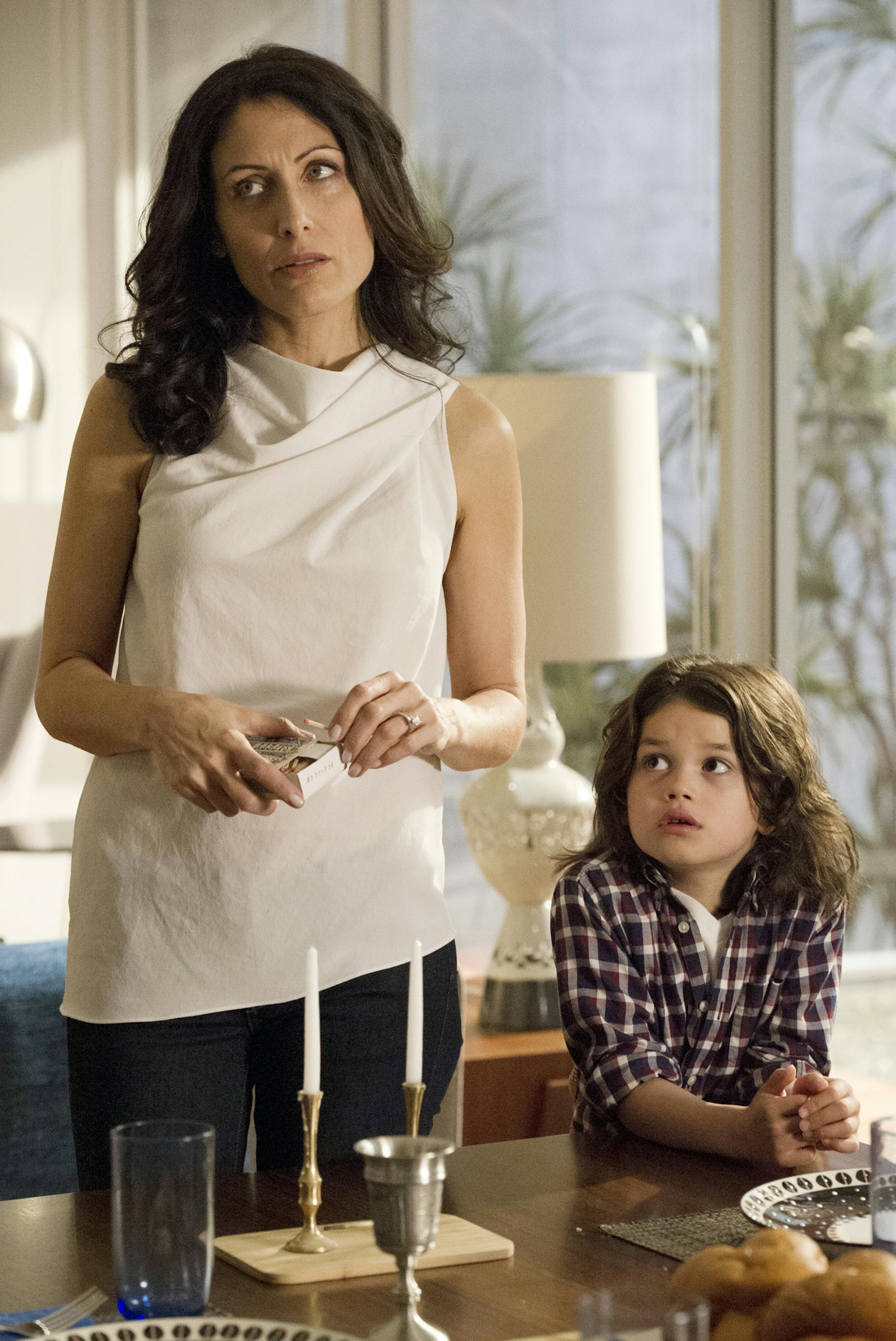 This image released by Bravo shows Lisa Edelstein, left, and Dylan Schombing in a scene from "Girlfriends' Guide to Divorce," Bravo's first original scripted series, premiering Dec. 2. (AP Photo/Bravo, Carole Segal)