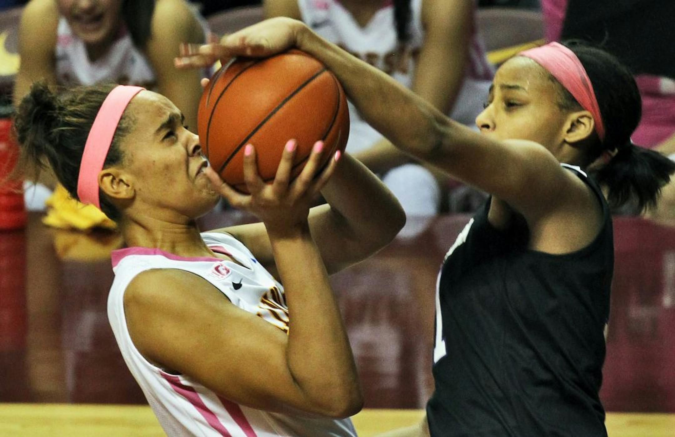 Kionna Kellogg's shot was blocked by Northwestern's Lauren Douglas. Kellogg had just one point and was 0-for-5 from the field. The Gophers shot only 30 percent from the floor in the second half.