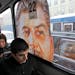 2010 photo: Commuters ride aboard a bus with a portrait of Soviet dictator Josef Stalin, in St. Petersburg, Russia.