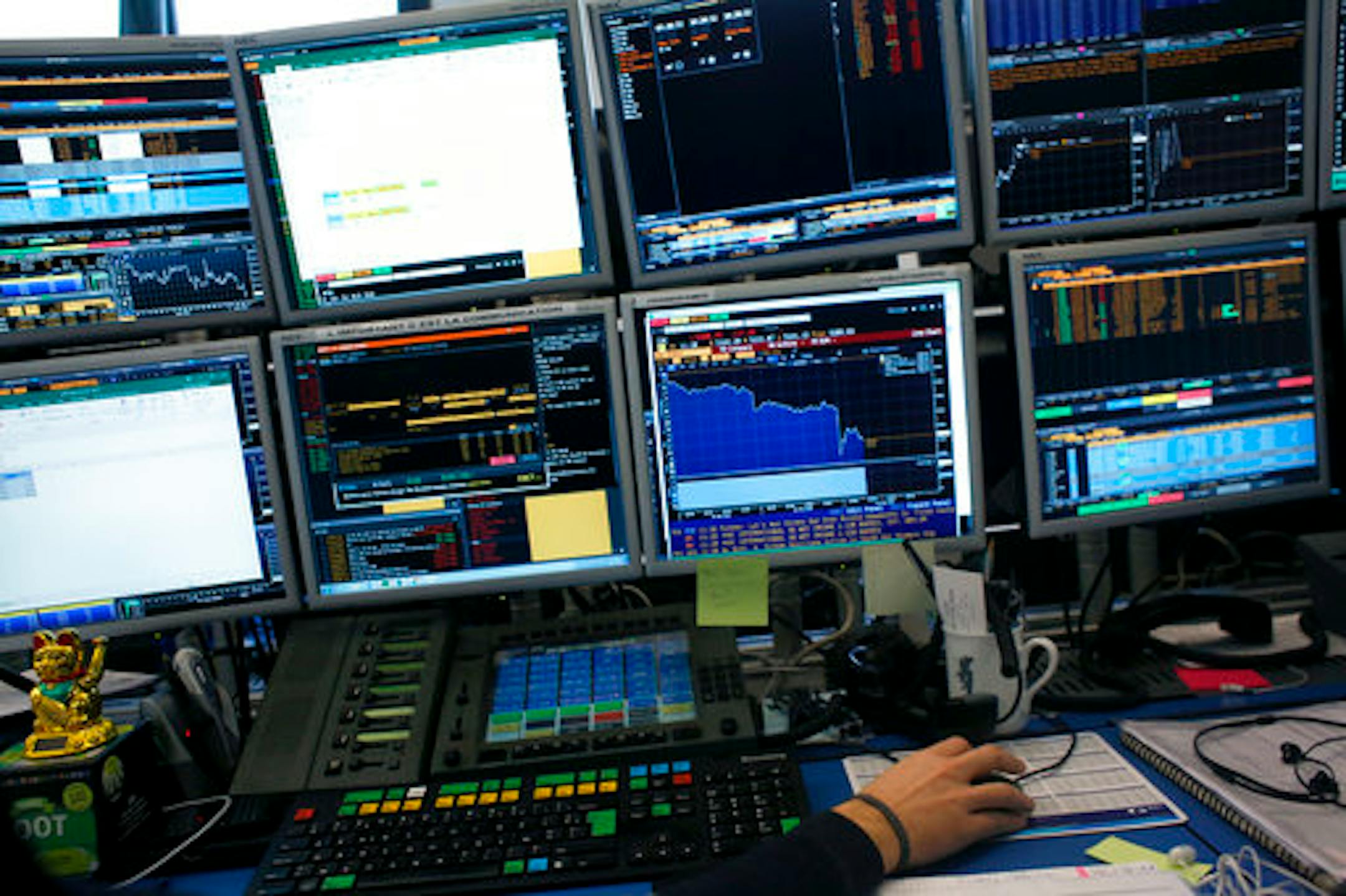 Monitors are seen in a brokerage firm in Paris, France, Tuesday, Feb. 6, 2018. Stock markets around the world took a battering Tuesday, following a dramatic sell-off on Wall Street that triggered concerns that a potentially healthy pullback from record highs could turn into a protracted bear market. (AP Photo/Thibault Camus)