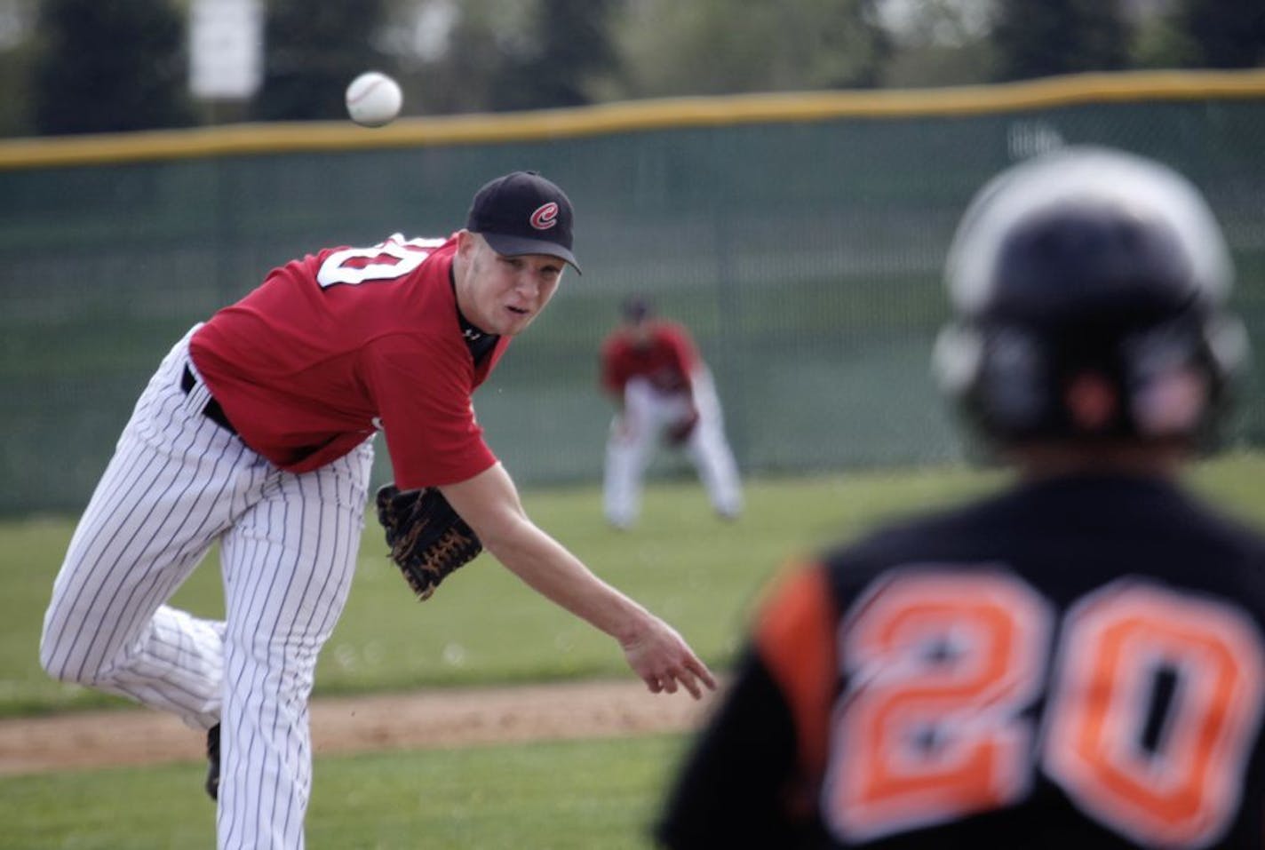 Centennial High's Chris Anderson delivers a pitch against Osseo in 2010