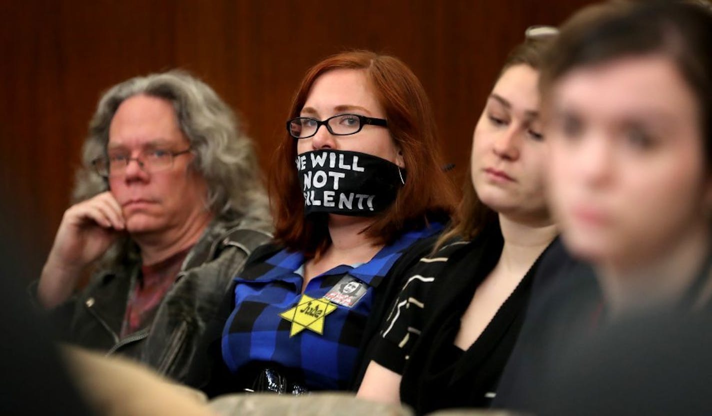 Protestor Amanda Wolfson, second from left, of St. Paul, sent a message without speaking while joining other protestors at a hearing that included discussion on a pair of house bills that would stiffen penalties on protestors who block highways, roads and transit Wednesday, Feb. 2017, at the State Office Building in St. Paul, MN.