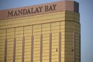 FILE - In this Monday, Oct. 2, 2017 file photo, drapes billow out of broken windows at the Mandalay Bay resort and casino on the Las Vegas Strip, foll
