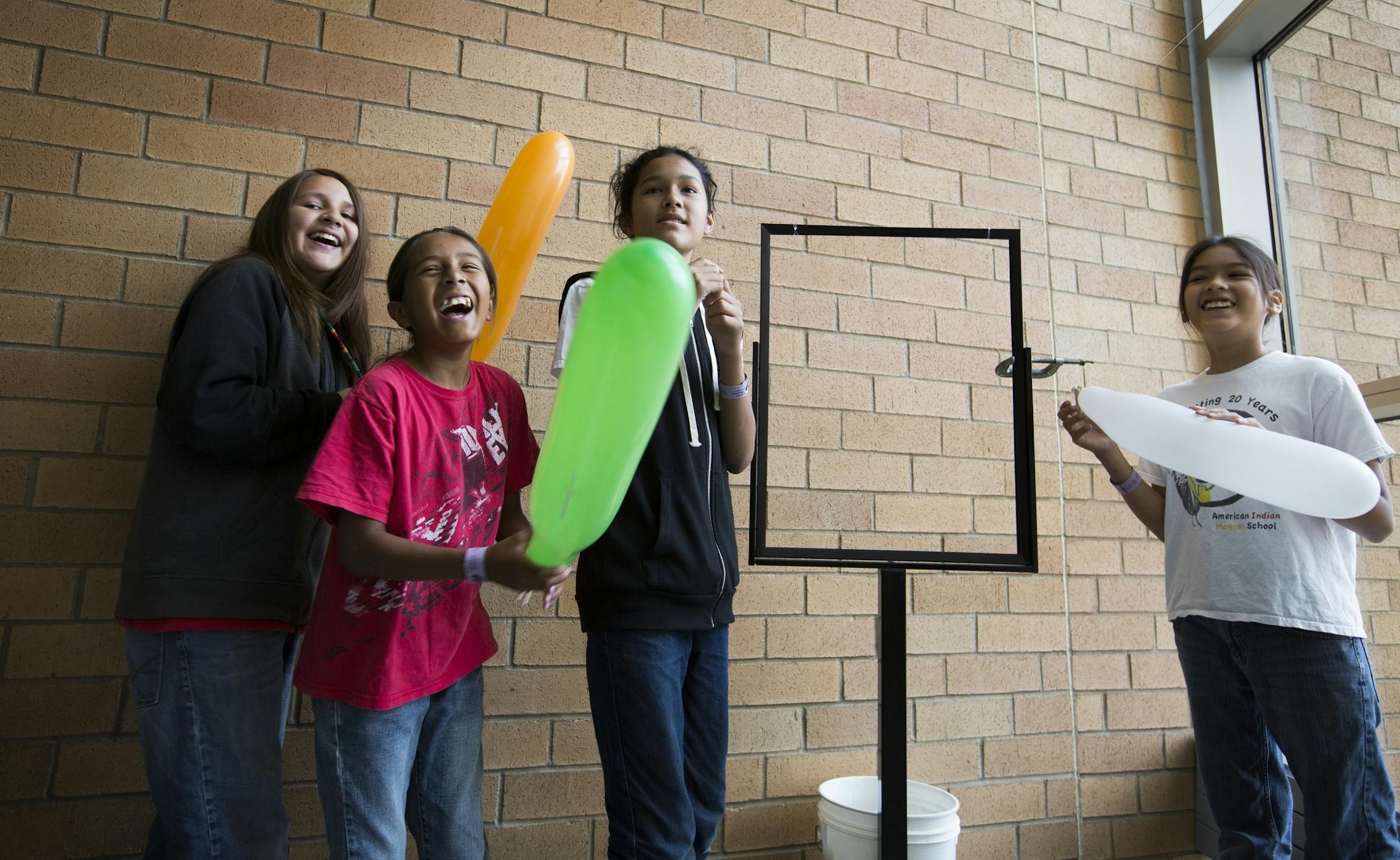 Nathan Berglund, from left, 11, Santino DeCory, 11, Bronson Grant, 14, and Quinlan Grant, 11, all of St. Paul, make balloon rockets at the Science Museum of Minnesota in St. Paul on Tuesday, June 30, 2015.