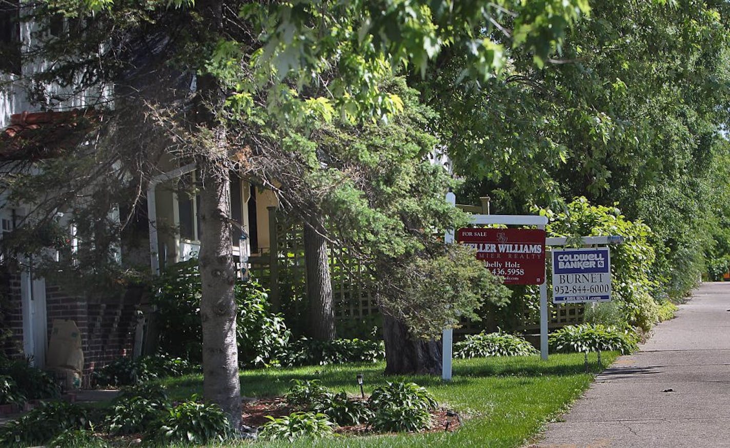 For-sale signs last year on the 3400 block of Hennepin Avenue: Statewide, the supply of houses for sale fell 53 percent last month.