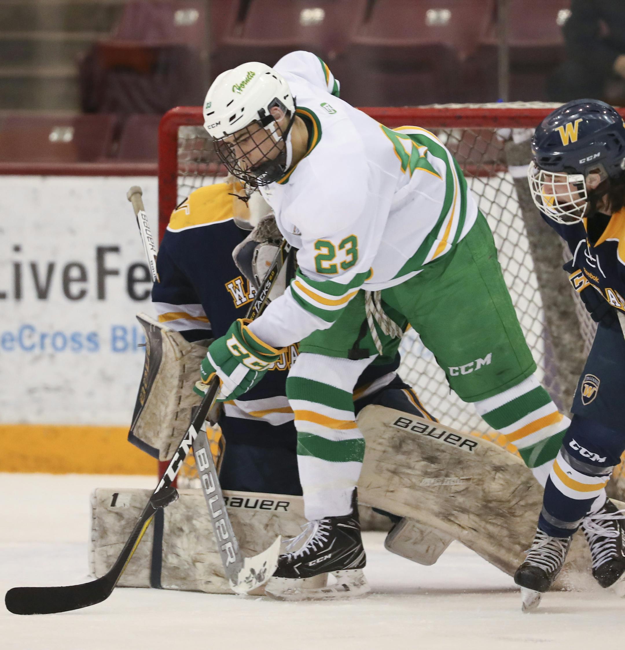 Edina's Demetrios Komountzis tried to deflect an incoming puck in front of Wayzata goalie Trevor Wong in the second period. Wayzata's Matt Branton was at right. ] JEFF WHEELER ï jeff.wheeler@startribune.com Edina faced Wayzata in the Class 2A, Section 6 boys' hockey tournament championship Wednesday night, February 28, 2018 at 3M Arena at Mariucci in Minneapolis.