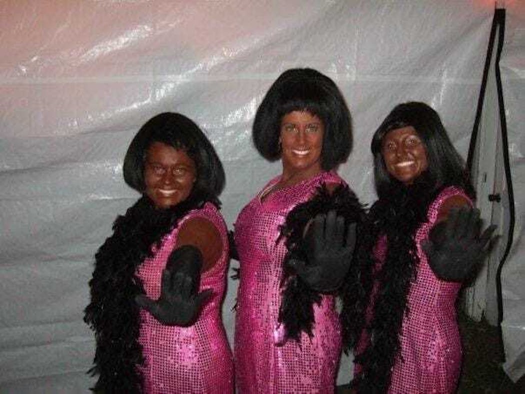 This undated photo, sent to Hennepin Healthcare leadership, depicts EMS Deputy Chief Amber Brown, left, wearing blackface makeup along with a current and former paramedic.