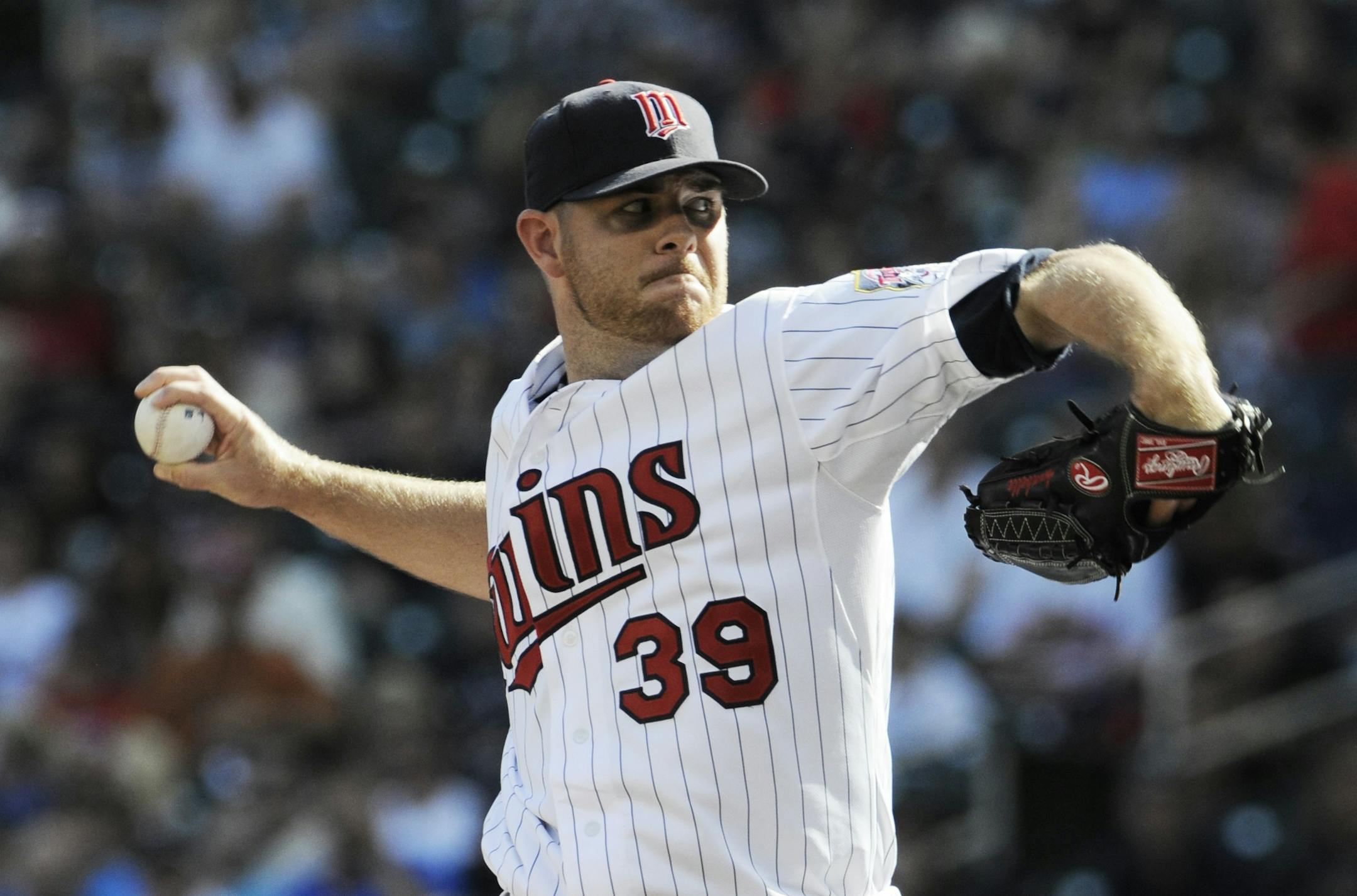 Minnesota Twins' P.J. Walters throws to a Detroit Tigers batter during the first inning of a baseball game Saturday, Sept. 29, 2012 in Minneapolis.