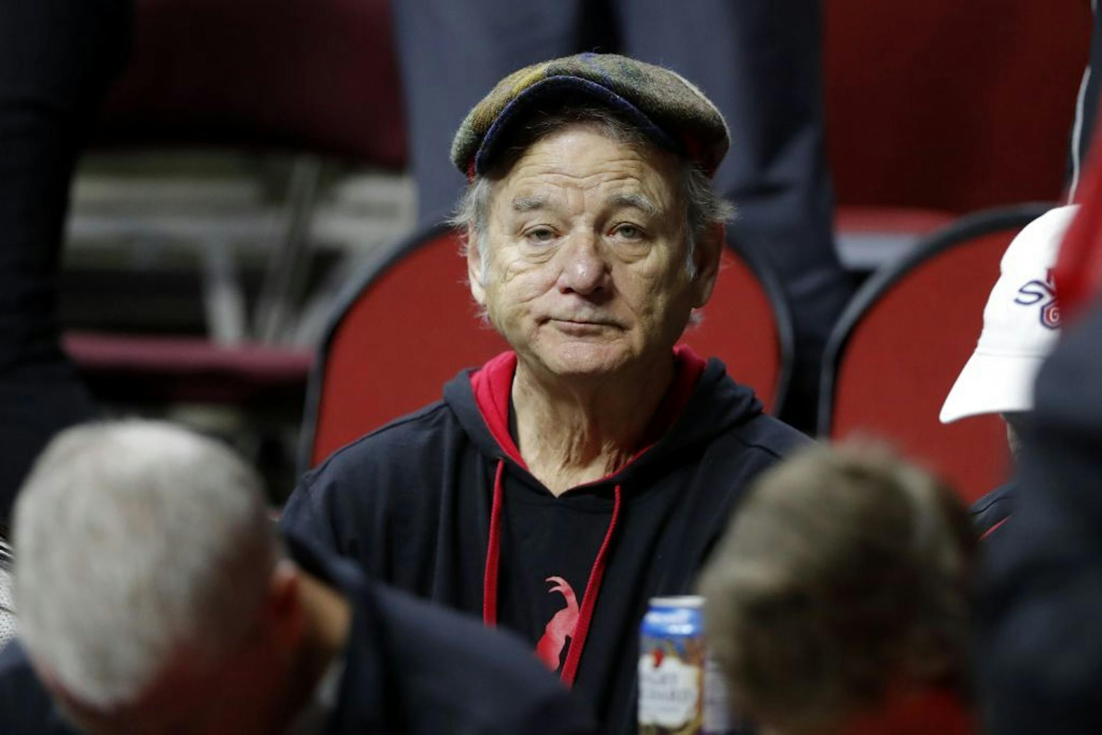 Actor Bill Murray sits in the stands before a first round men's college basketball game between Minnesota and Louisville in the NCAA Tournament, Thursday, March 21, 2019, in Des Moines, Iowa.