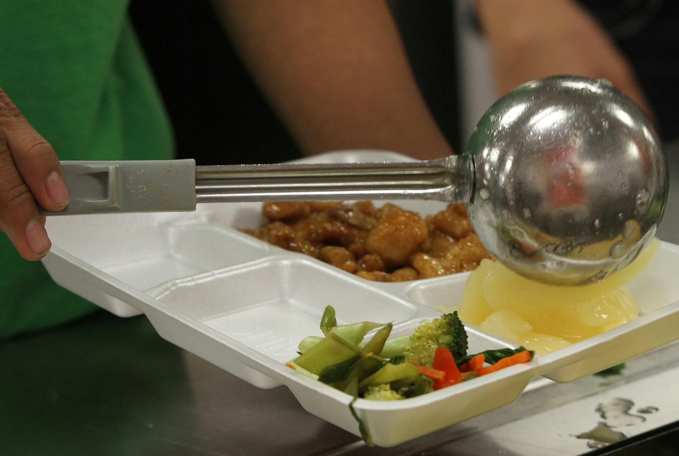 Students at Westwood Intermediate School in Blaine scooped up fresh fruits and vegetables while getting lunch on 10/10/12. Some students are starting to rebel against the new school nutrition guidelines, claiming that the reduction of salt and fats has also reduced the taste of the meals and the caloric count that they require. Districts say the food is healthier and better for kids but will take time to get used to it. Chef Marshall O'Brien, who works with about a dozen school districts to make