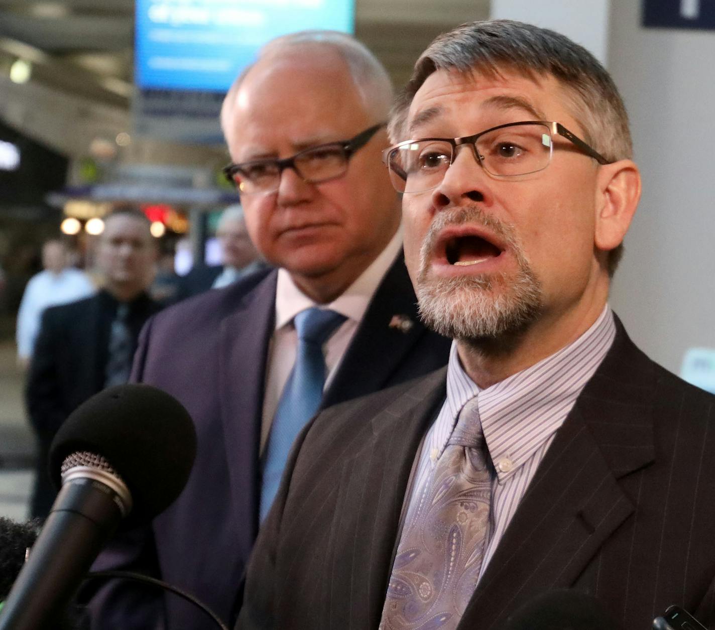 With Gov. Tim Walz looking on, Daniel Huff, Assistant Commissioner for the Minnesota Health Department Protection Bureau, answered questioned that arose about coronavirus during a press conference debuting the new REAL ID Office at MSP Airport Wednesday, March 4, 2020, in Minneapolis, MN. It was revealed during the press conference that two people arriving at the Minneapolis-St. Paul Airport on Tuesday have been instructed to self-quarantine themselves for 14 days due to their &#x201c;close cont