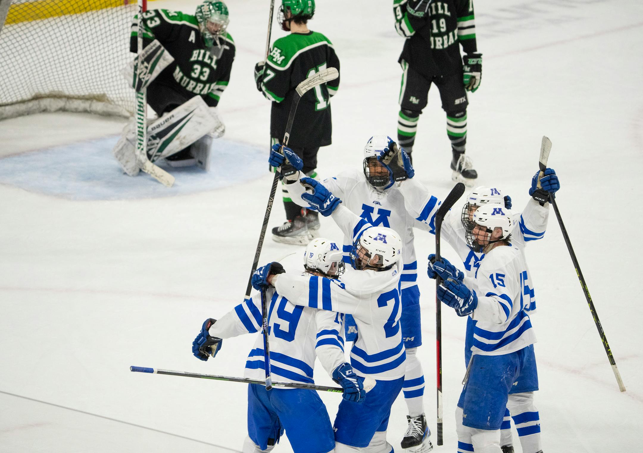 Minnetonka Skippers forward Hagen Burrows (19) was congratulated on his game-tying third period goal that sent the game into overtime.