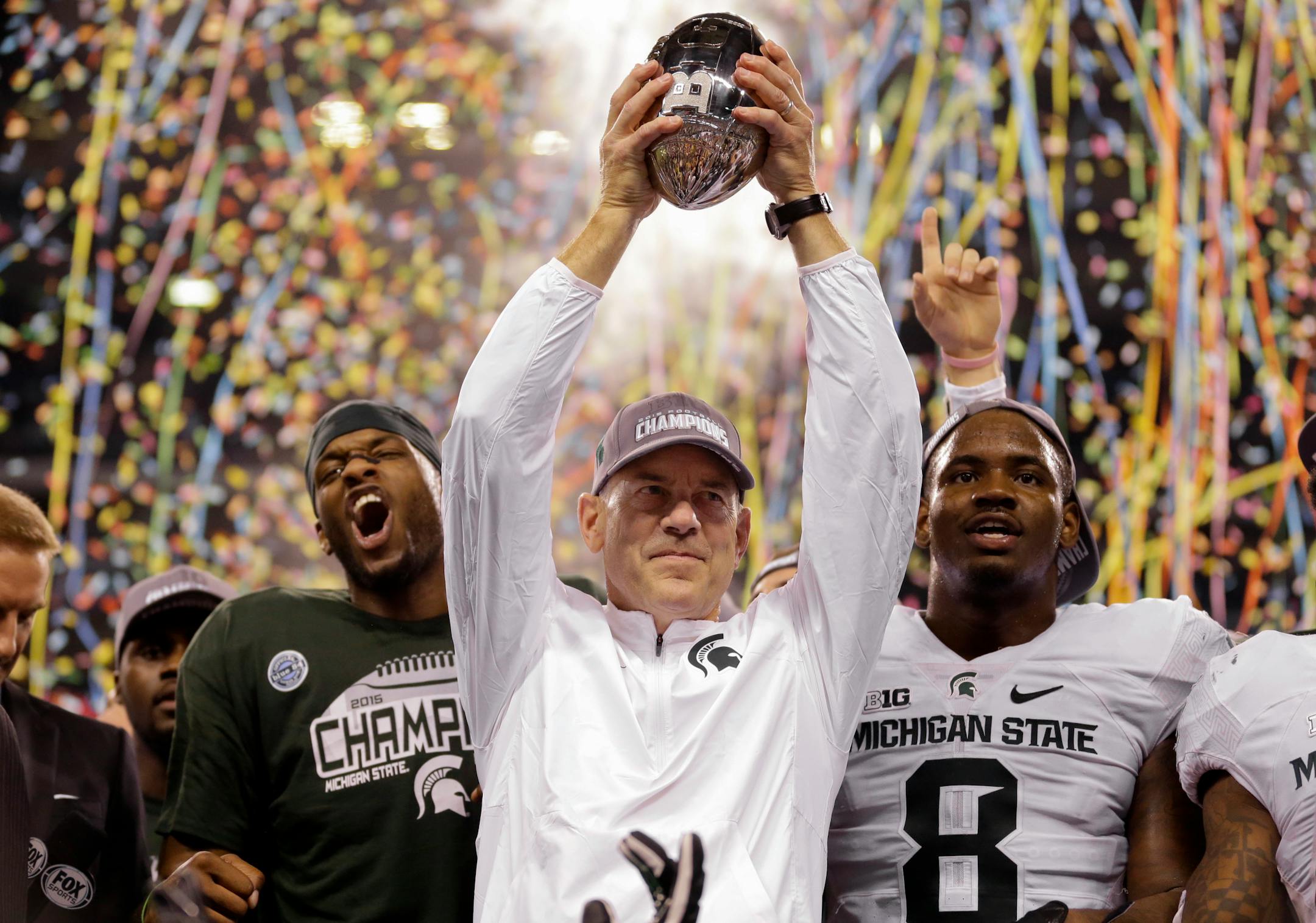Coach Mark Dantonio and Michigan State celebrated their Big Ten Championship Game victory over Iowa last year.