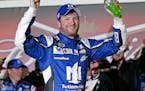 Dale Earnhardt Jr celebrates in Victory Lane after winning the first of two qualifying races for the Daytona 500 NASCAR Sprint Cup series auto race at