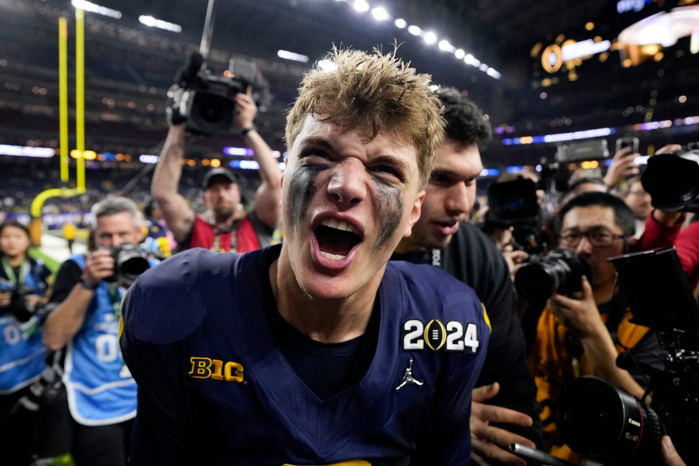 Michigan quarterback J.J. McCarthy celebrates after their win in the national championship NCAA College Football Playoff game against Washington Monday, Jan. 8, 2024, in Houston. (AP Photo/David J. Phillip)