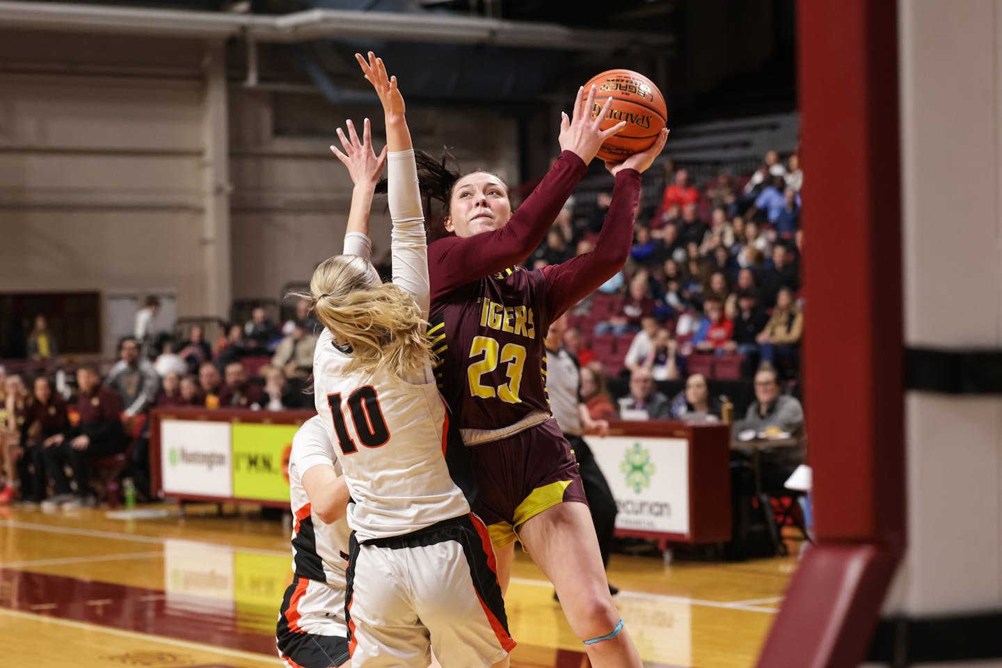 Stewartville's Savannah Hedin (23) drives to the basket around Katelyn Jamtgaard (10) in the second half. Photo by Cheryl A. Myers, SportsEngine