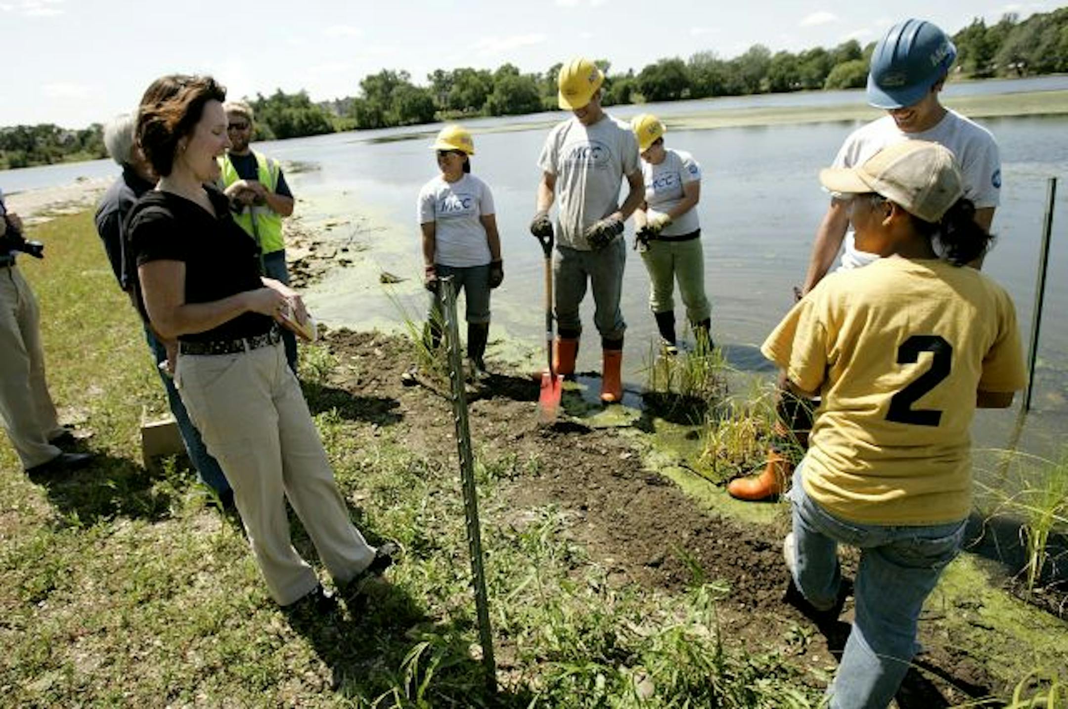 With the U.S. House on break, Democratic Rep. Betty McCollum, left, was back home, visiting Minnesota Conservation Corps workers near Duck Point on Como Lake. McCollum has held one town hall meeting and says she has plans for more.