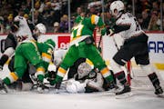 Minnesota Wild players try and fail to get the puck into the goal in the second period of the game against the Arizona Coyotes at Xcel Energy Center o