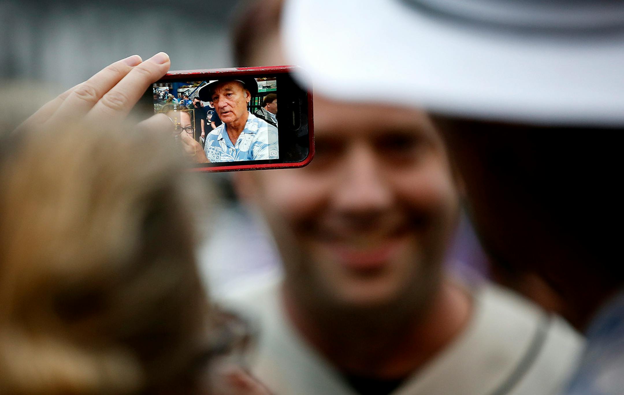 While taking tickets at the entry gate Bill Murray stopped to take pictures with fans as they walked into Midway Stadium. ] CARLOS GONZALEZ cgonzalez@startribune.com - August 28, 2014, St. Paul, Minn., Midway Stadium, St. Paul Saints baseball vs. Winnipeg - Final Saints game at Midway Stadium