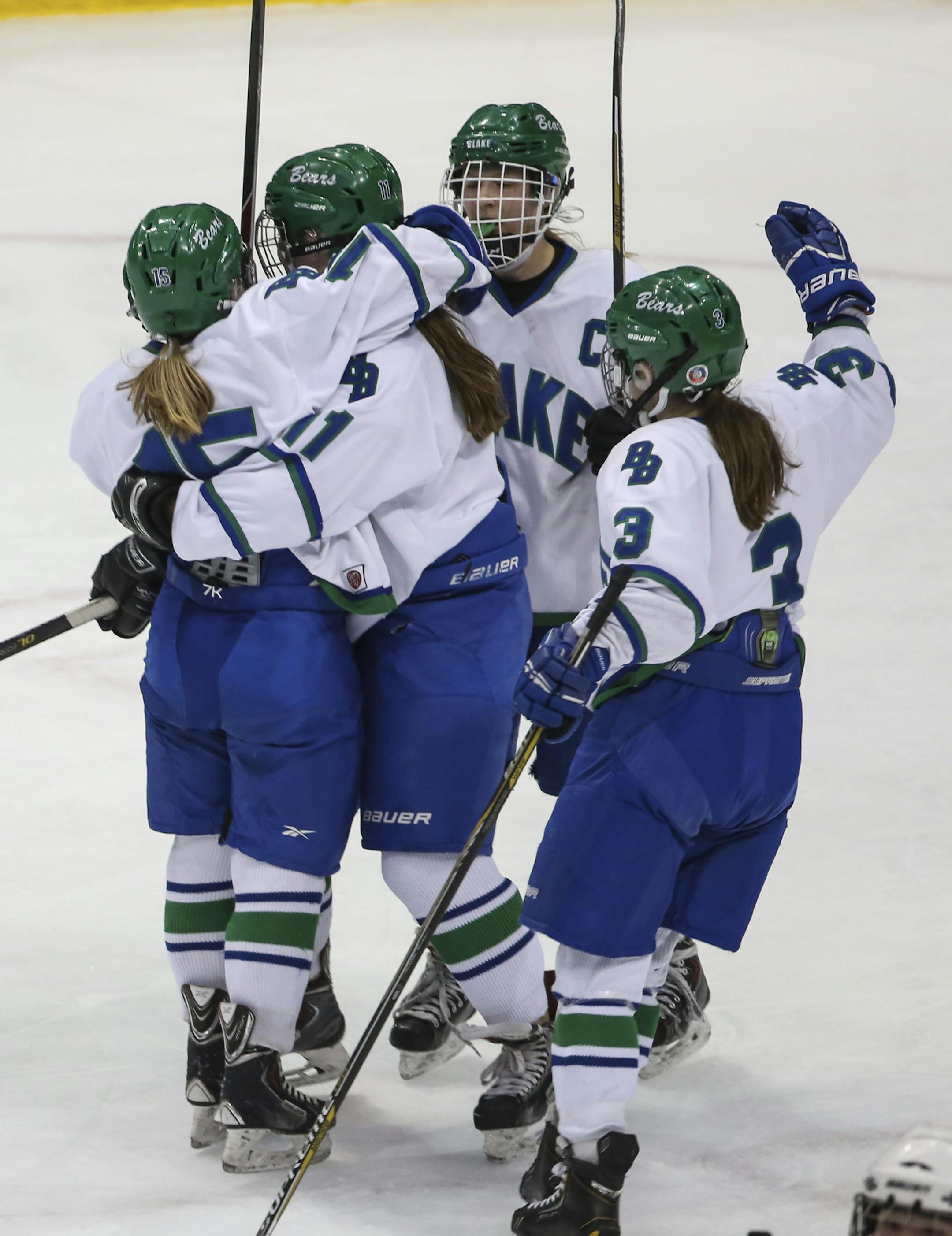 Teammates hugged Sarah Chute (15) (at left) after she scored the first goal during the second period. ] RENEE JONES SCHNEIDER • reneejones@startribune.com The Red Wing verses The Blake School semifinals at the High School Girls Hockey State Tournament at the Xcel Energy Center in St. Paul, Minn., on Friday, February 20, 2015. ORG XMIT: MIN1502201326072215